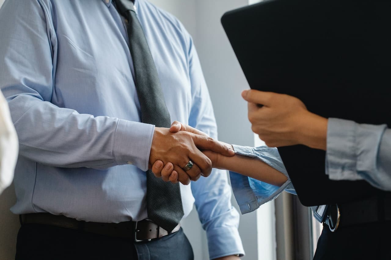 Two business people shaking hands